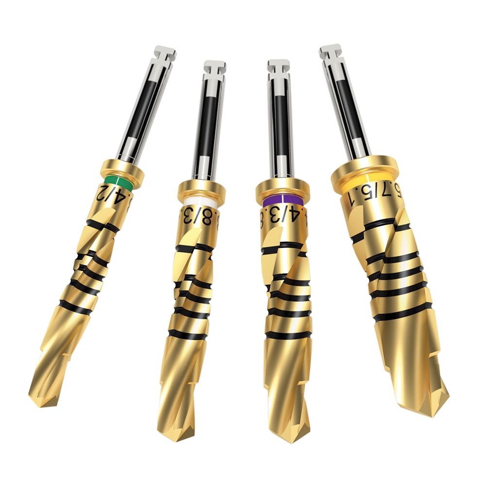 Four Dríva™ Gold Series dental drills with gold finish, depth markings, and color-coded rings for precision implant preparation.